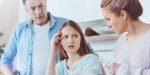 TEENAGER DISCUSSING WITH PARENTS