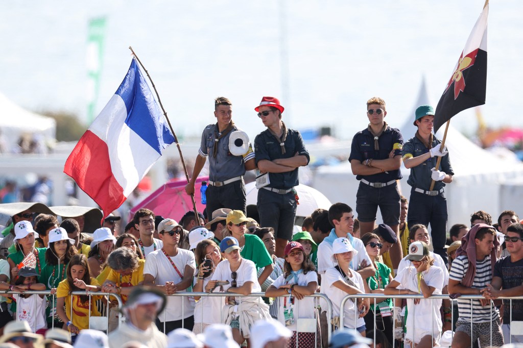 French scouts attend the closing mass of the World Youth Days