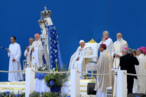 Pope Francis waves as he arrives to celebrate mass at the Velodrome stadium in the southern port city of Marseille